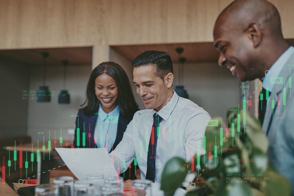 Professionals analyzing financial data on laptop.