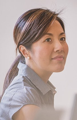 A woman with long hair and a ponytail.