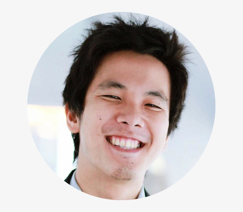 A man with black hair smiling for the camera.